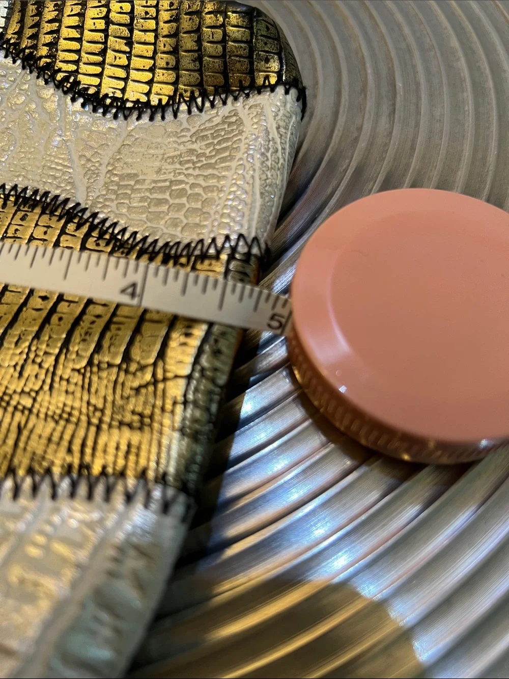 A DUO GOLD and SILVER DECORATIVE POUCH SET.